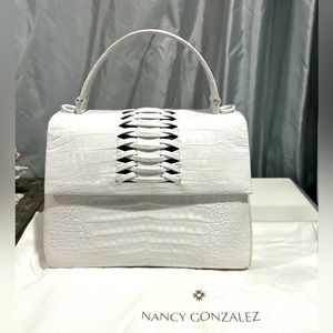 Brand new Nancy Gonzalez genuine alligator bag with inside tag, dust bag, straps